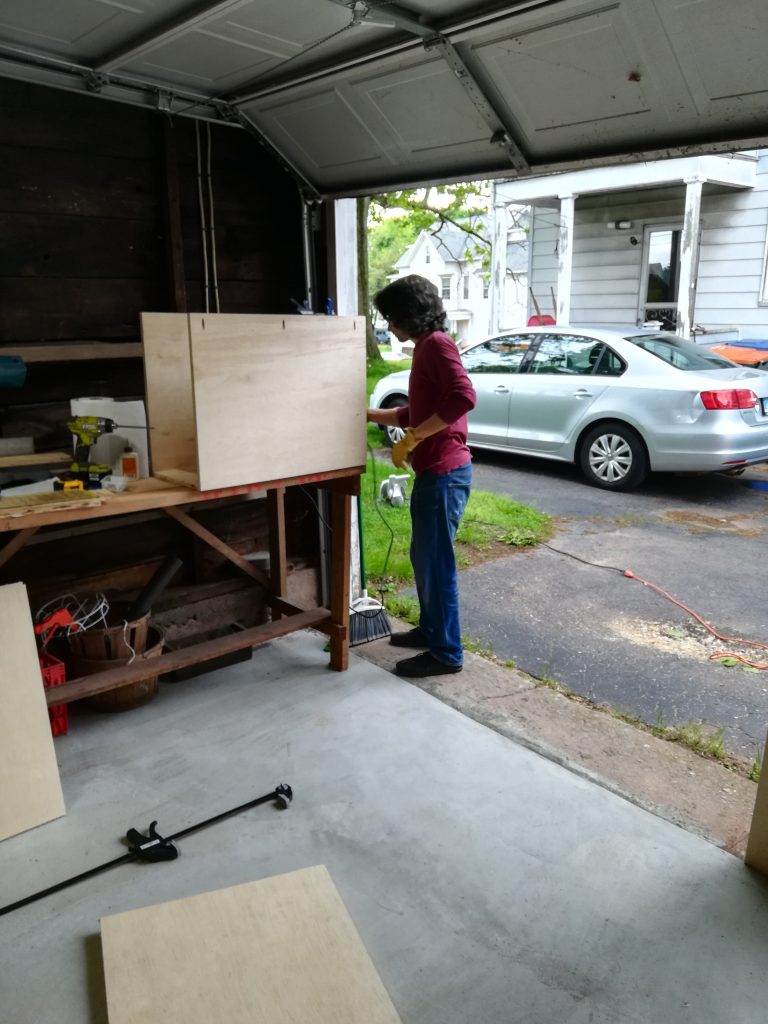 my husband building kitchen cabinets