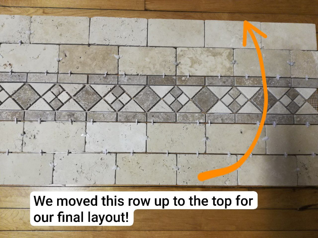 laying out tile as preparation for our DIY tile backsplash