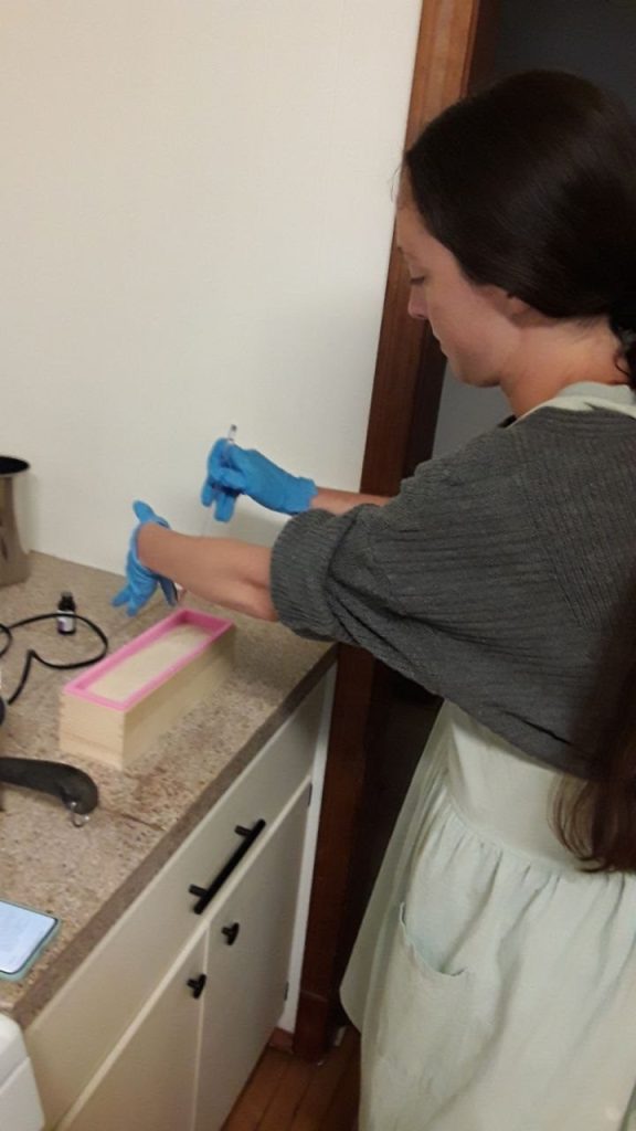 me pouring soap into mold