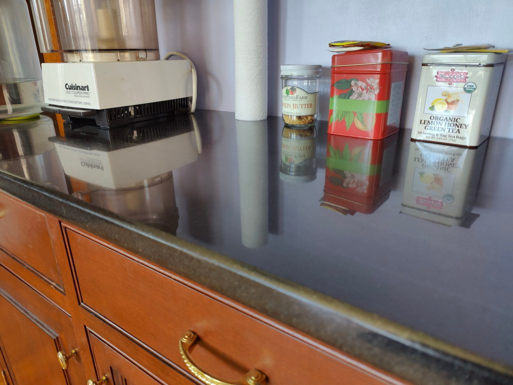 granite counter after cleaning with white green cloth
