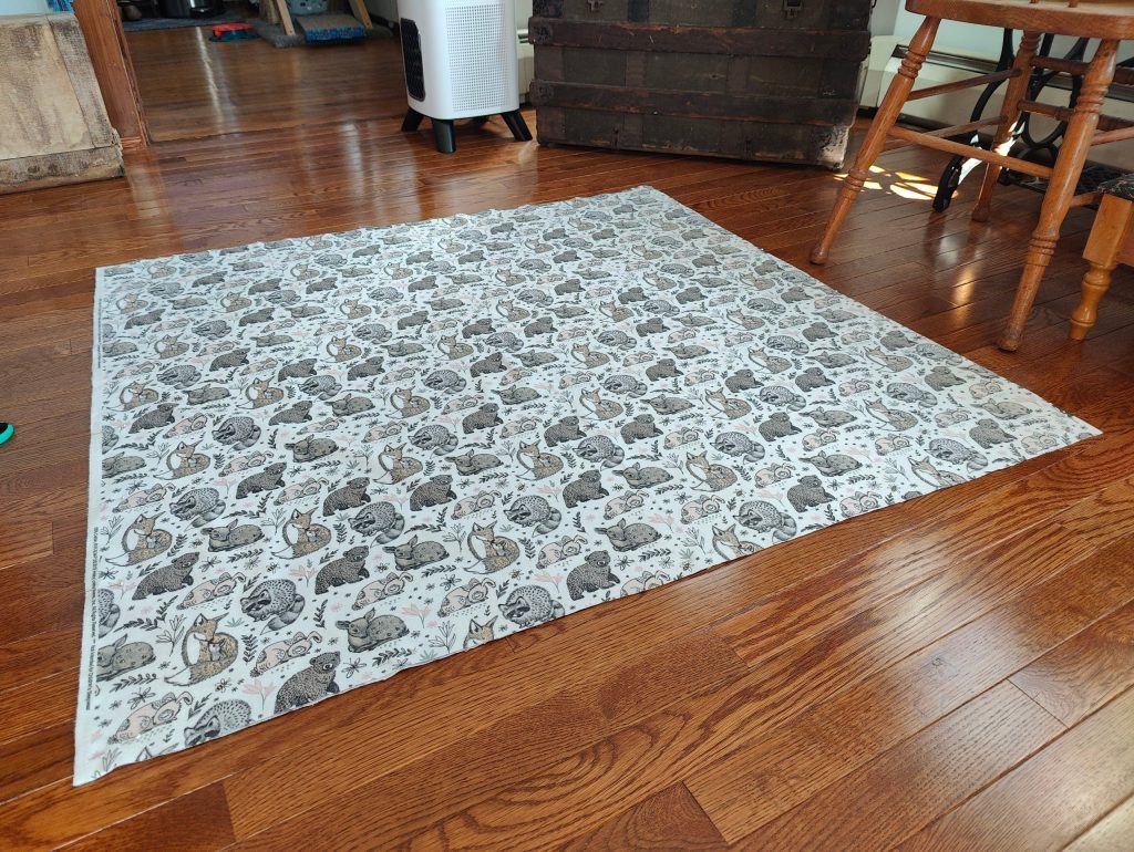 fabric laid out flat for pinning pattern pieces