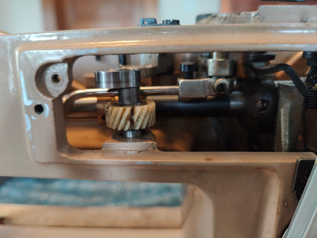 vintage sewing machine with cracked gear