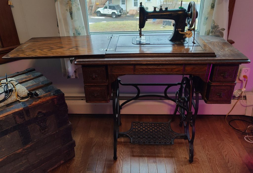 antique sewing table open with machine